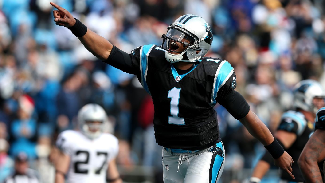 Cam Newton of the Carolina Panthers celebrates after throwing a touchdown pass to teammate Steve Smith against the Oakland Raiders at Bank of America Stadium on Sunday in Charlotte, North Carolina. 