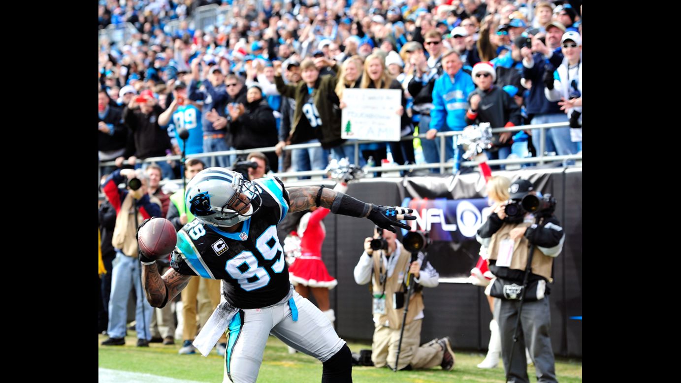 Steve Smith of the Panthers throws the ball into the stands after scoring a touchdown against the Raiders on Sunday.