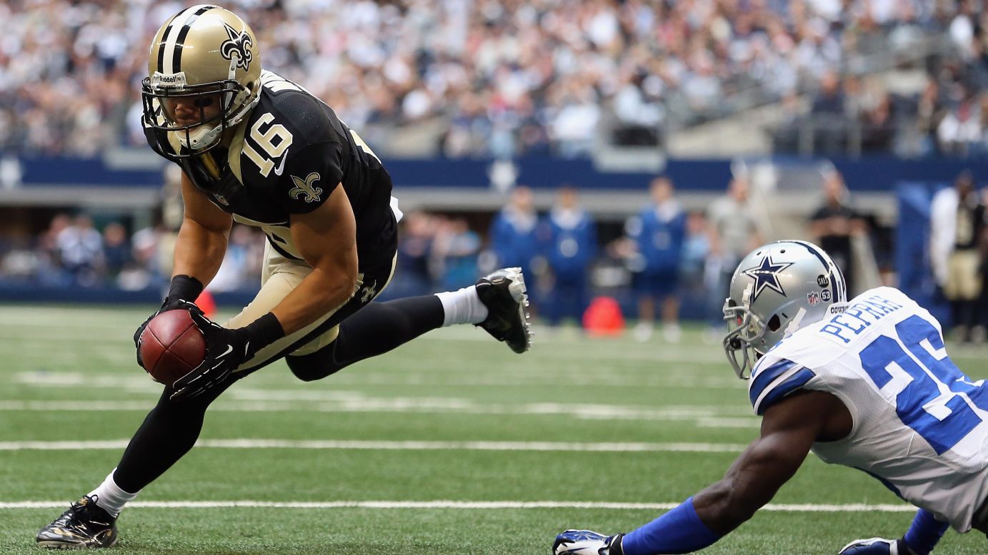 Lance Moore of the Saints runs for a touchdown past Charlie Peprah of the Cowboys on Sunday.