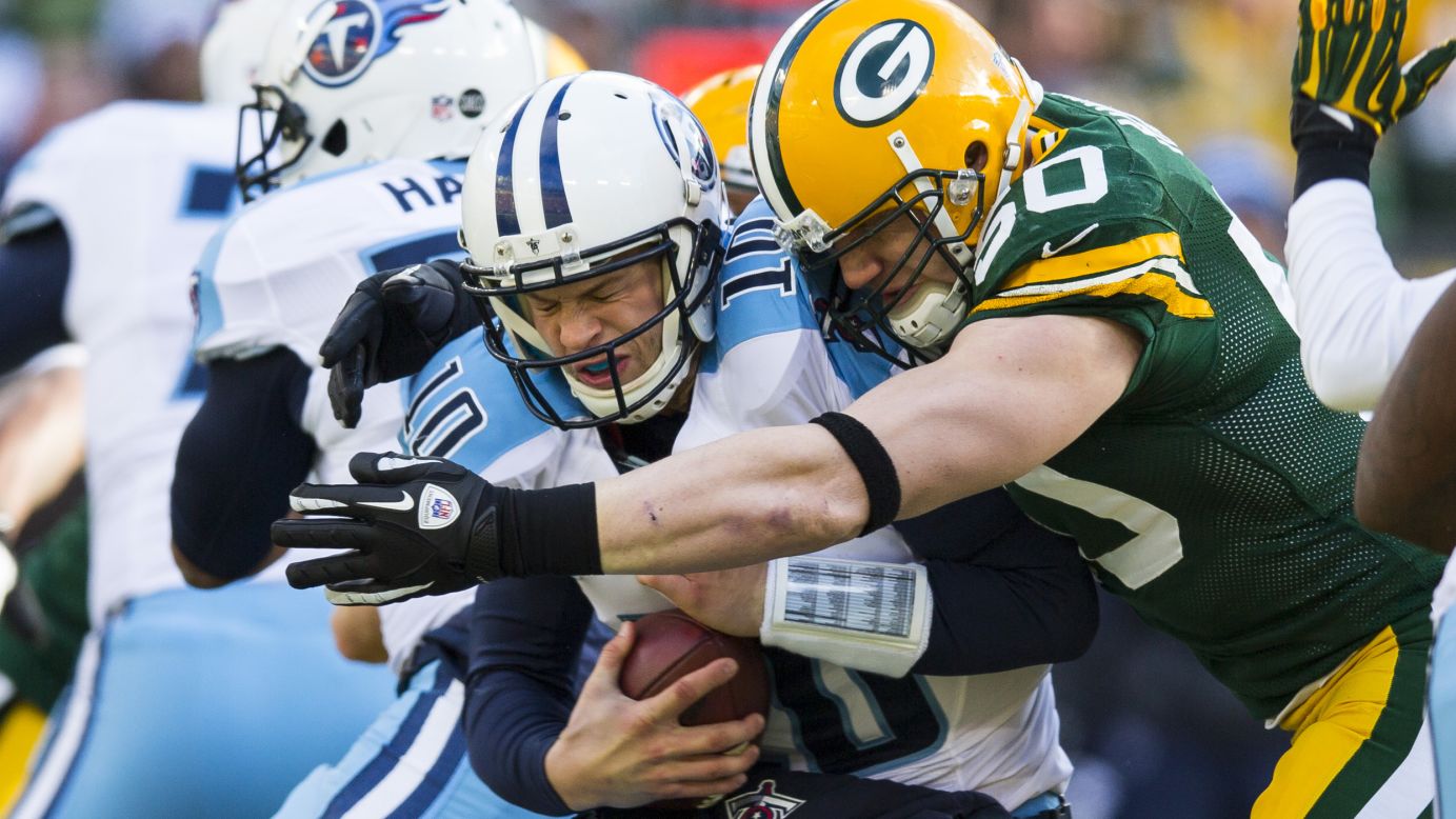 A.J.Hawk of the Green Bay Packers sacks Jake Locker of the Tennessee Titans at Lambeau Field on Sunday in Green Bay, Wisconsin, on Sunday.
