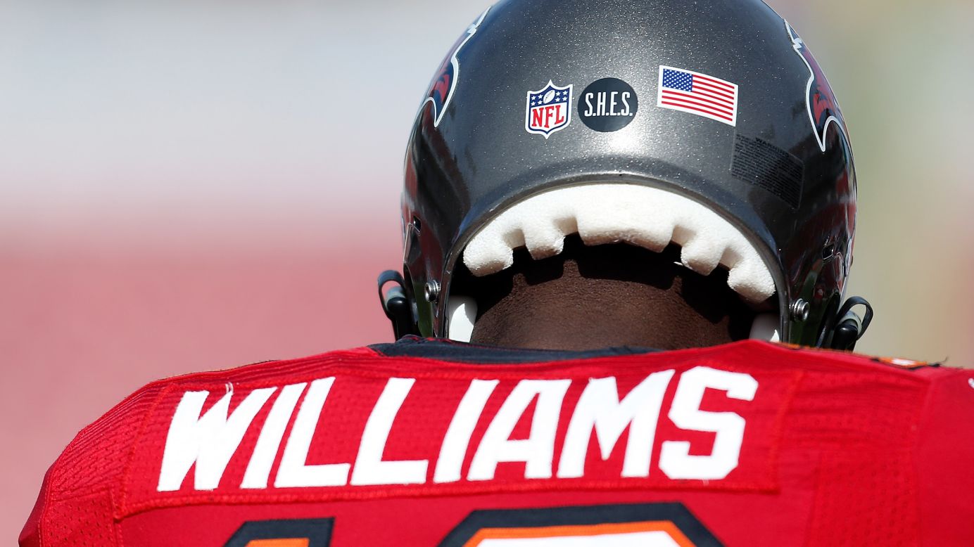 Players for the Tampa Bay Buccaneers wear a Sandy Hook Elementary School decal on their helmets during the game against the St. Louis Rams at Raymond James Stadium on Sunday in Tampa, Florida.