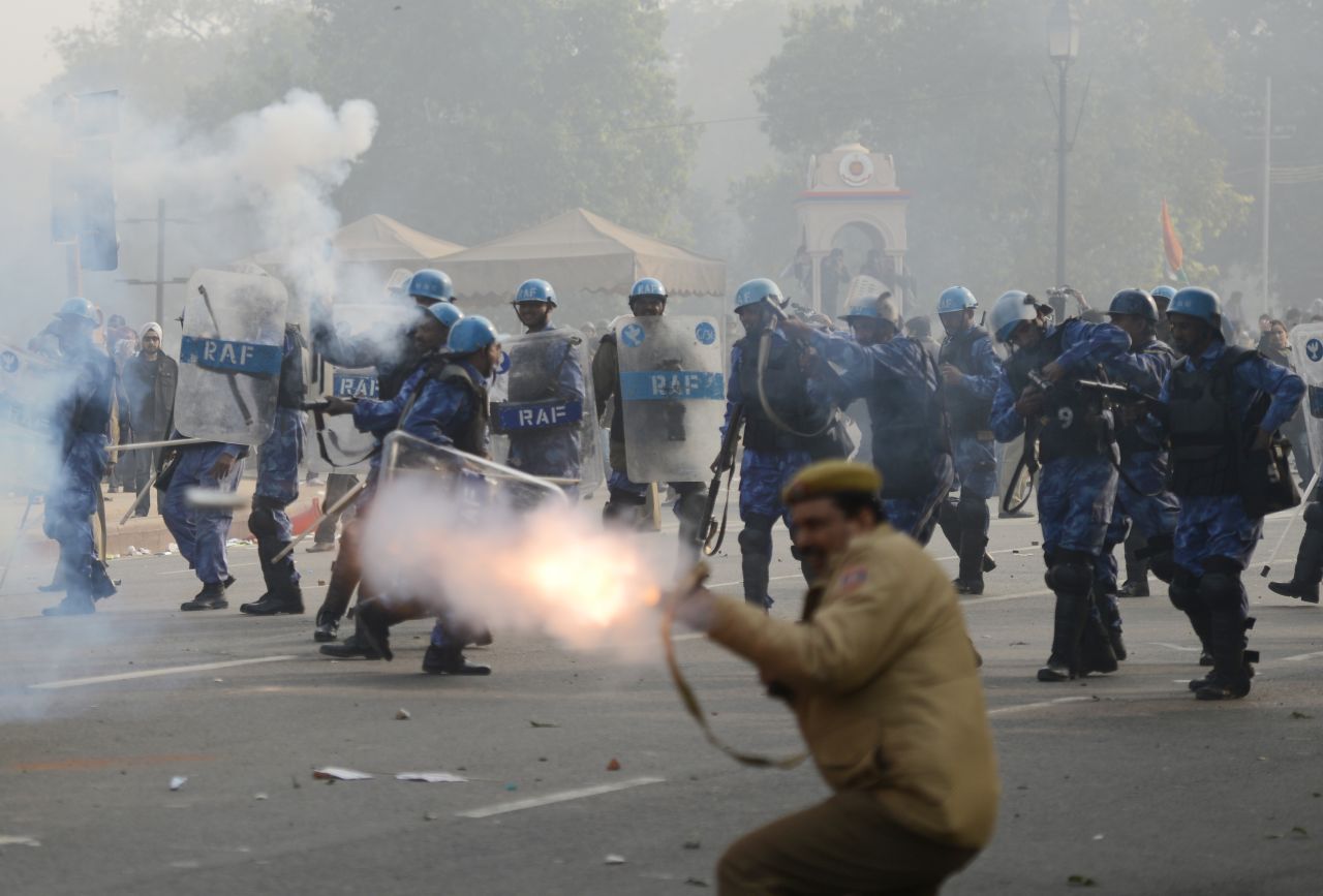 Police fire tear gas on Sunday, December 23, during a protest calling for better safety for women following last week's rape. Thousands of protesters defied a ban on demonstrations in New Delhi on Sunday, venting their anger about the incident.