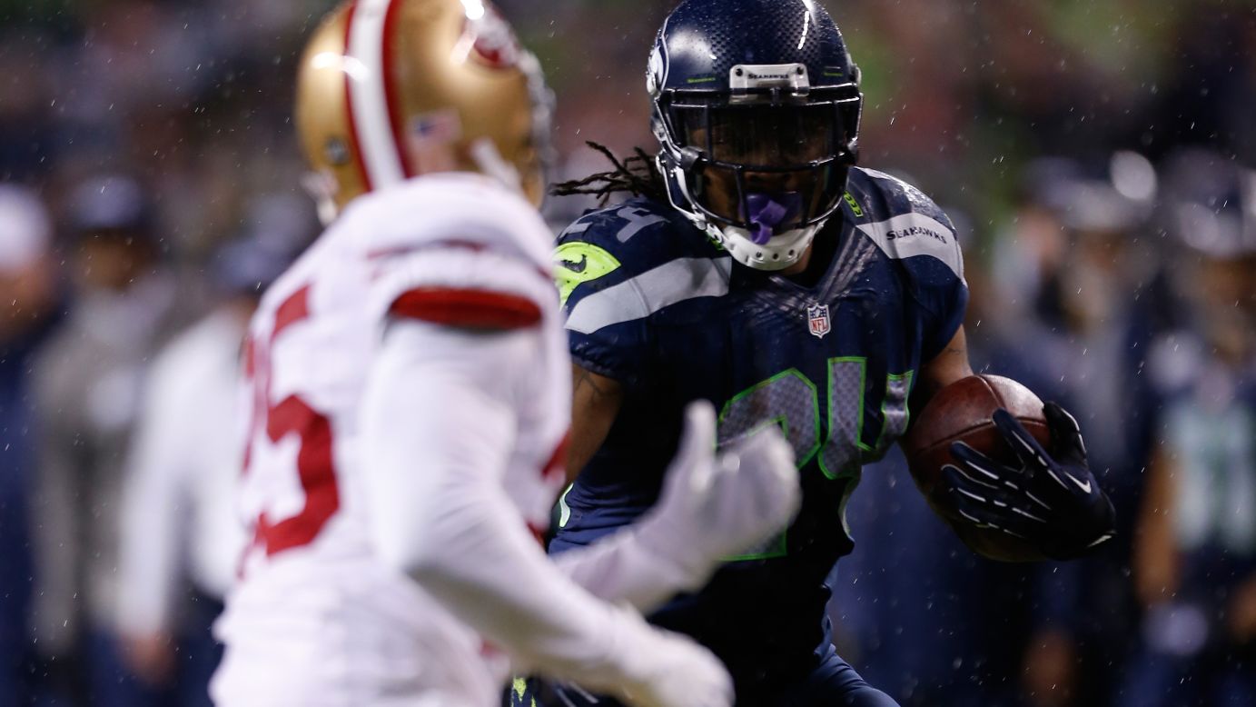 Marshawn Lynch of the Seattle Seahawks runs the ball in the first half against the San Francisco 49ers on Sunday.