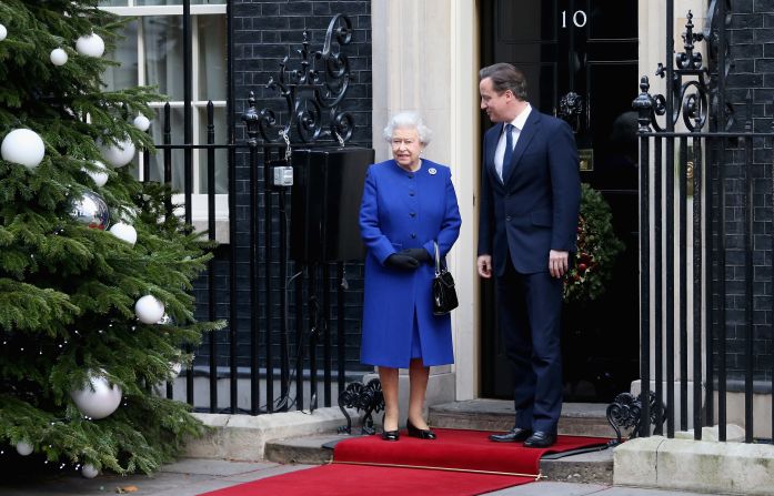 The queen is greeted by Prime Minister David Cameron as she arrives at Number 10 Downing Street to attend the Government's weekly Cabinet meeting on December 18, 2012. It was a historic occasion because it is thought to mark the first time a monarch has attended such a session since Queen Victoria more than a century ago.