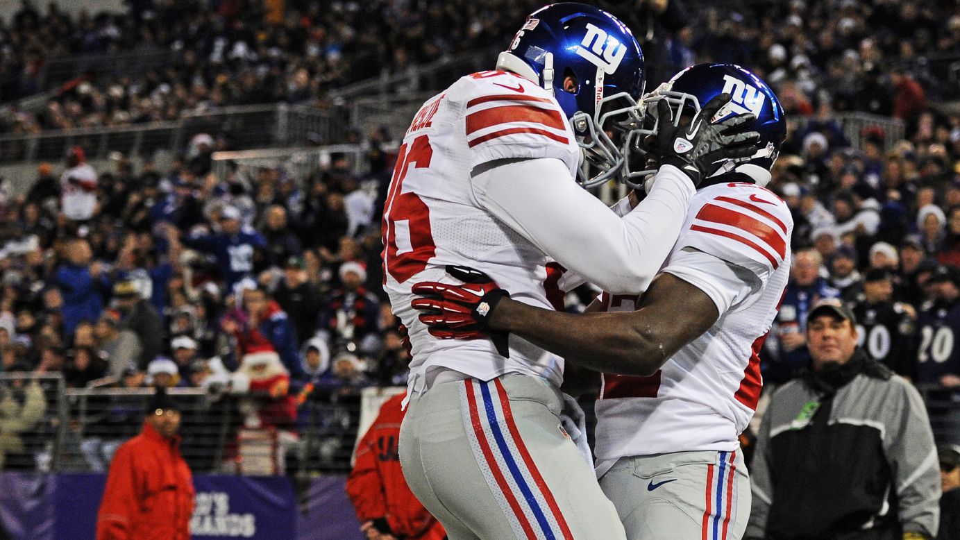 Running back David Wilson of the Giants celebrates after scoring against the Ravens in the first quarter on Sunday.