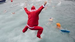 The cold water of Barcelona's Port Vell doesn't deter this swimmer dressed up as St. Nick from joining in the Copa Nadal swimming race, a traditional holiday event in the Spanish seaport, on Tuesday, December 25.