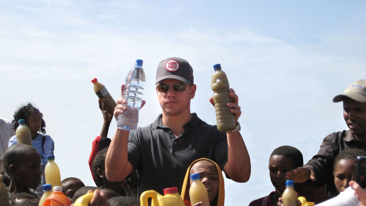 Actor Matt Damon hands out clean drinking water to children in Ethiopia. Damon helped found water.org in 2009.