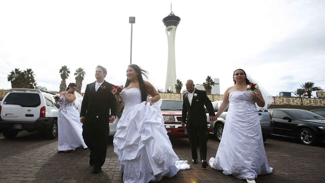 Newlyweds await their wedding photos at the Little Chapel of the Flowers in Las Vegas on December 12, 2012.