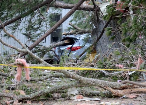The storm winds knocked down trees, destorying cars and homes near Troy, Alabama, on December 26.