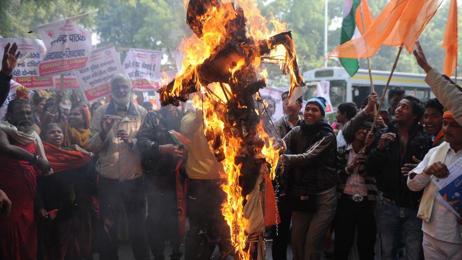 Indian demonstrators burn an effigy representing rapists during a protest in New Delhi on December 26, 2012.