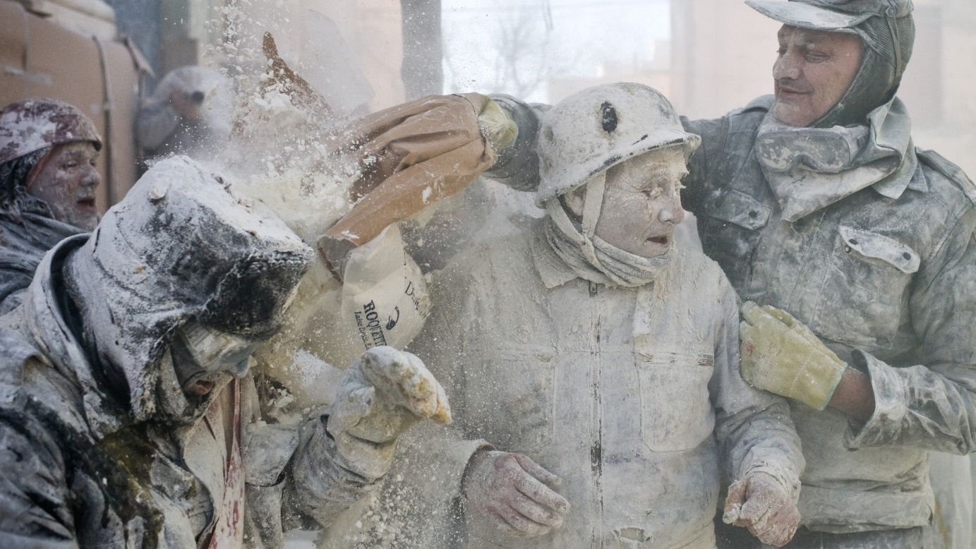 A man throws flour during the battle on December 28.