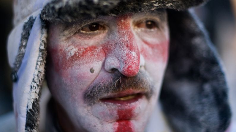 A reveler poses for a photograph on December 28.