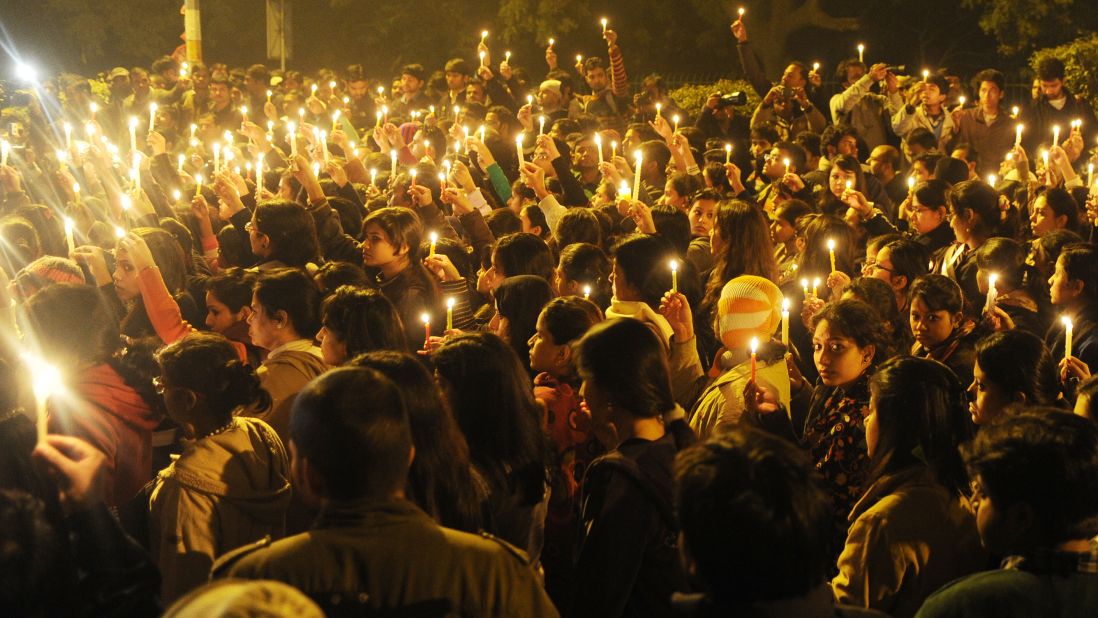 Protesters hold candles during a vigil in New Delhi on Saturday, December 29, after the death of a gang-rape victim. Authorities erected security barriers throughout New Delhi's key government district after two days of street battles following a woman's gang rape on a bus on December 16. Indian Prime Minister Manmohan Singh has appealed for calm and pledged safety for women and children.