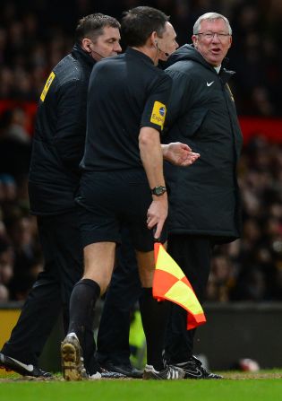 Alex Ferguson shouts at assistant referee Andy Garrett in scenes reminiscent of the midweek 4-3 win over Newcastle, after which the United manager was widely criticized for harrassing match officials.