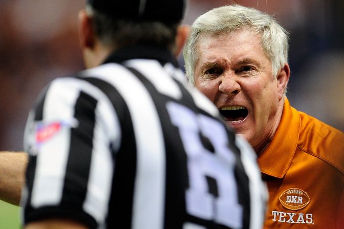 Longhorns head coach Mack Brown argues an official's call during the Valero Alamo Bowl.