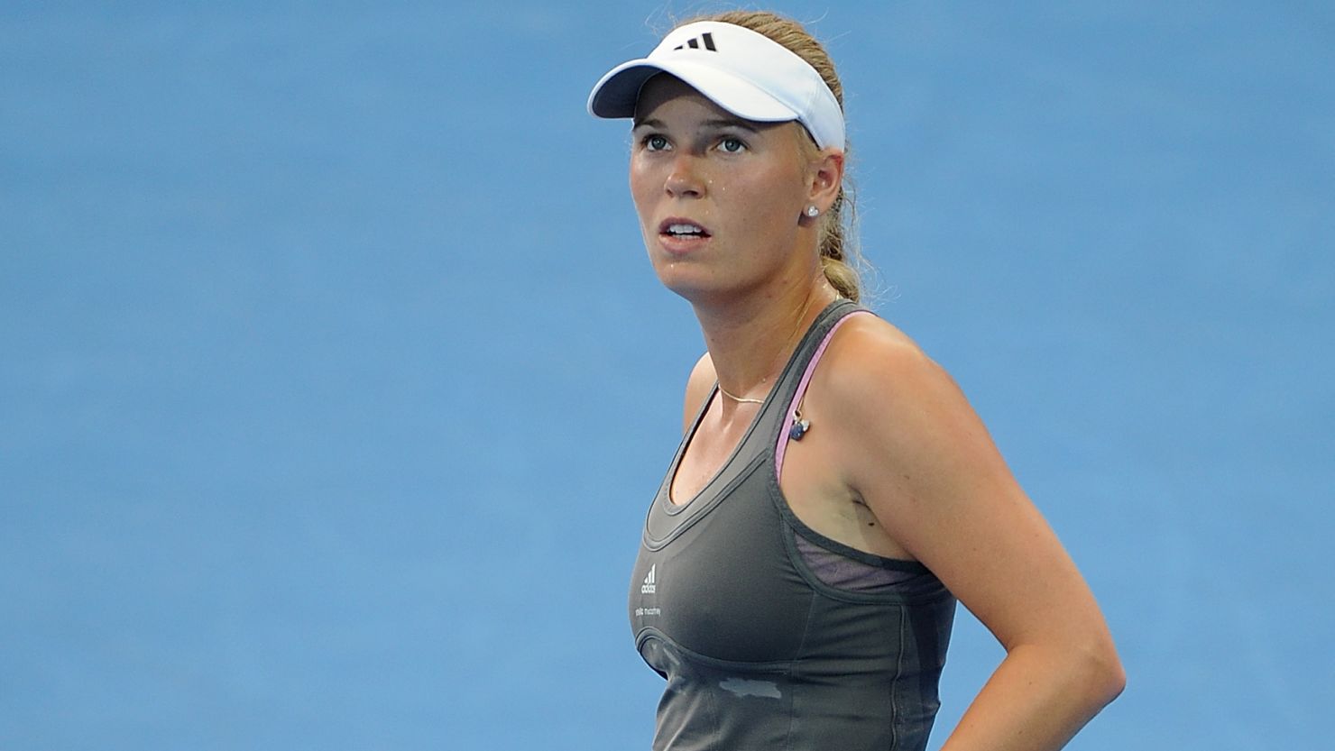 Caroline Wozniacki slips to defeat against qualifier Ksenia Pervak in the first round of the Brisbane International.