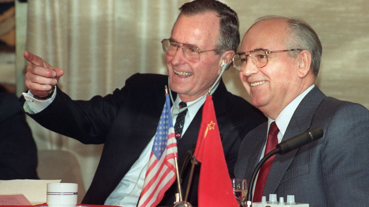 President George H.W. Bush shares a joke with Soviet leader Mikhail Gorbachev on December 3, 1989.