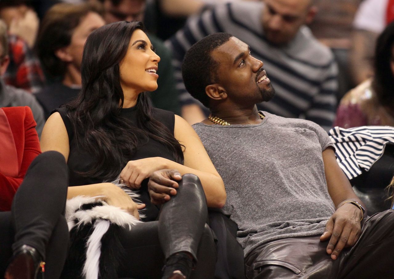 Kim and Kanye were all smiles as they cuddled up at one of their favorite haunts: courtside at a basketball game, this time watching the Denver Nuggets face the Los Angeles Clippers on December 25, 2012. By the following Sunday, Kanye spilled the beans that they were expecting daughter North.