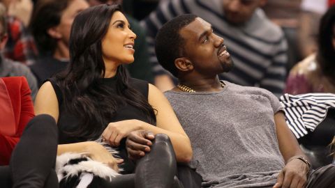 Kim and Kanye were all smiles as they cuddled up at one of their favorite haunts: courtside at a basketball game ,this time watching the Denver Nuggets face the Los Angeles Clippers on December 25. By the following Sunday, Kanye spilled the beans that they were expecting.