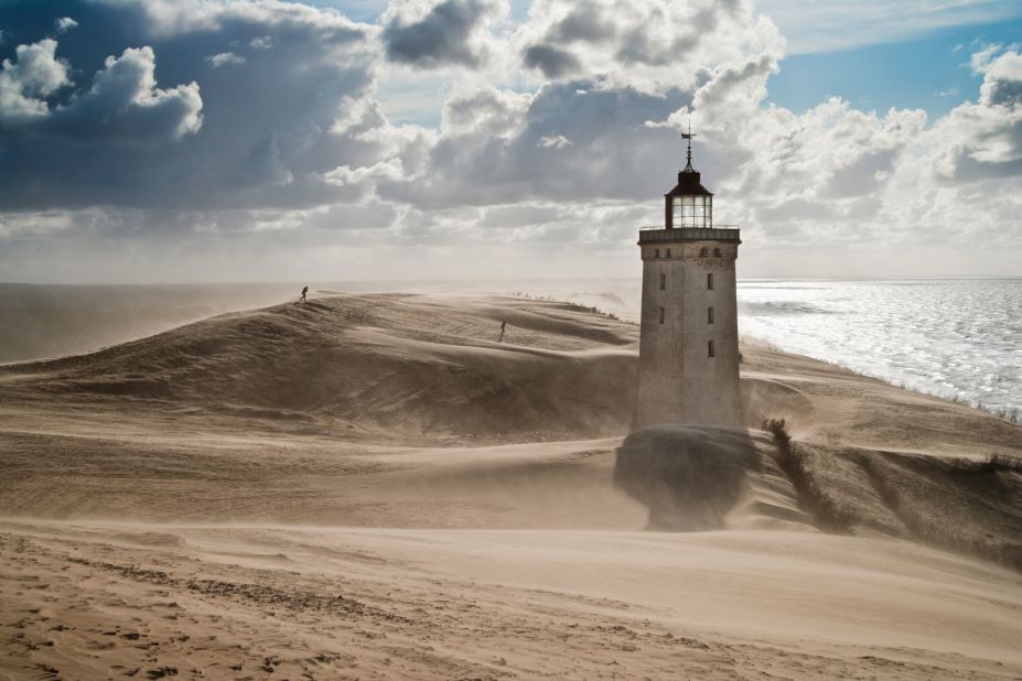The Rubjerg Knude lighthouse in Hjørring, Denmark. this ghostly sentinel was built in 1900 but abandoned in 1968.