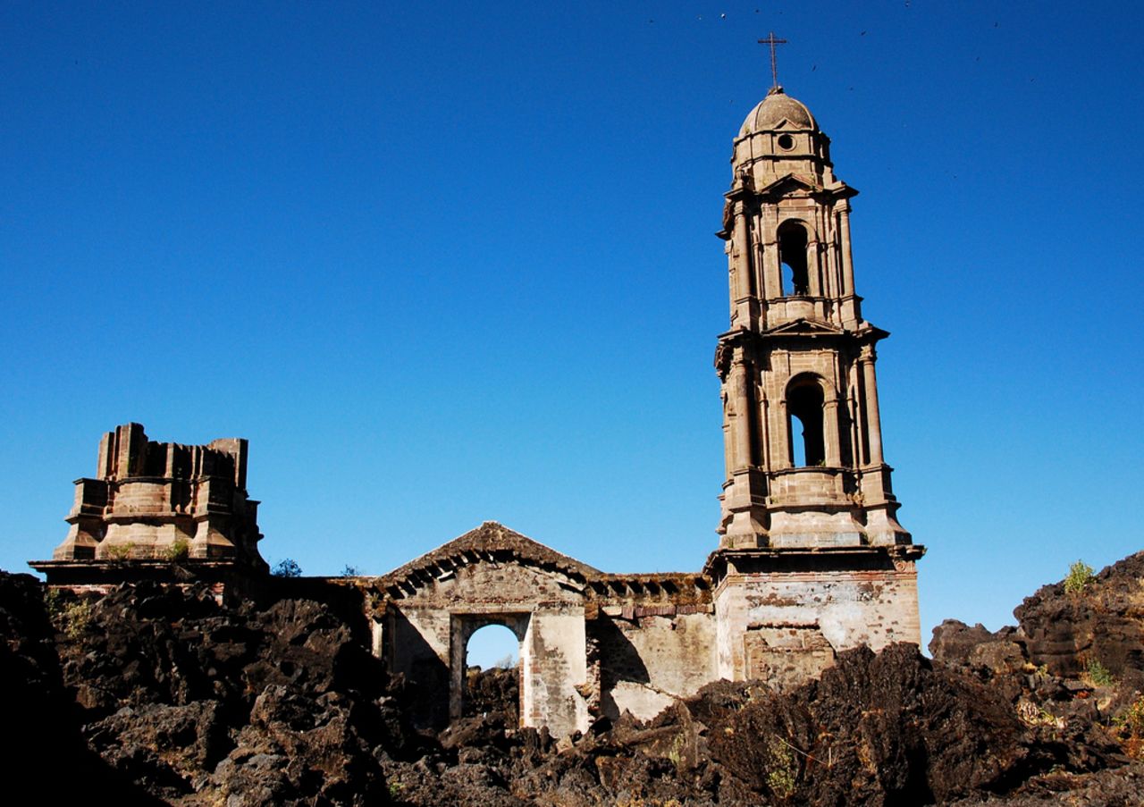 The surviving San Juan Parangaricutiro ruins in Michoacán, Mexico. In 1943, an explosive volcano eventually buried San Juan Parangaricutiro and another village.