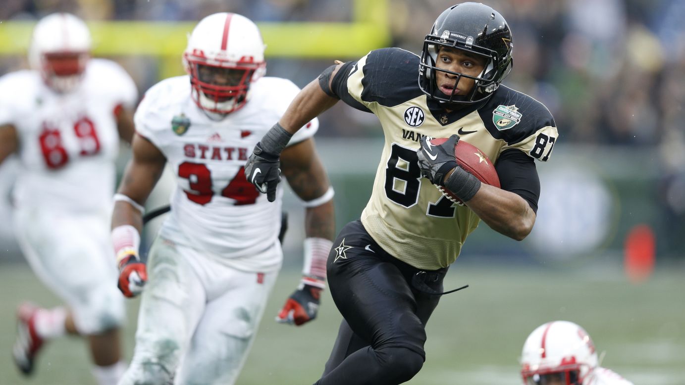 Jordan Matthews of the Vanderbilt Commodores heads toward the end zone for an 18-yard touchdown catch and run against the North Carolina State Wolfpack on December 31.