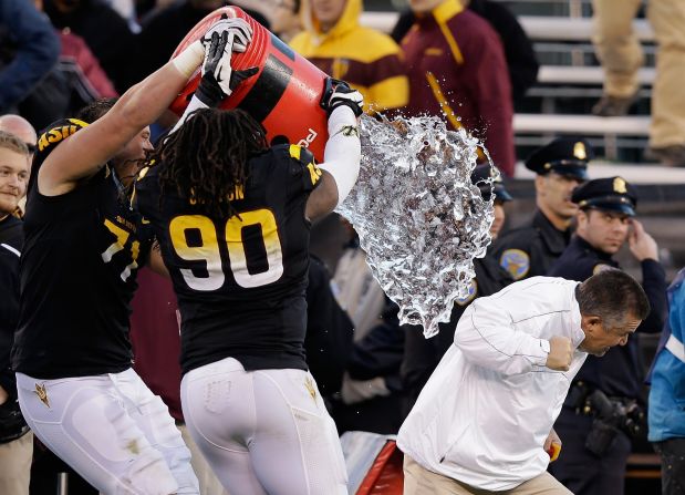 Arizona State head coach Todd Graham is doused by his players after they beat the Navy Midshipmen in the Kraft Fight Hunger Bowl on December 29.