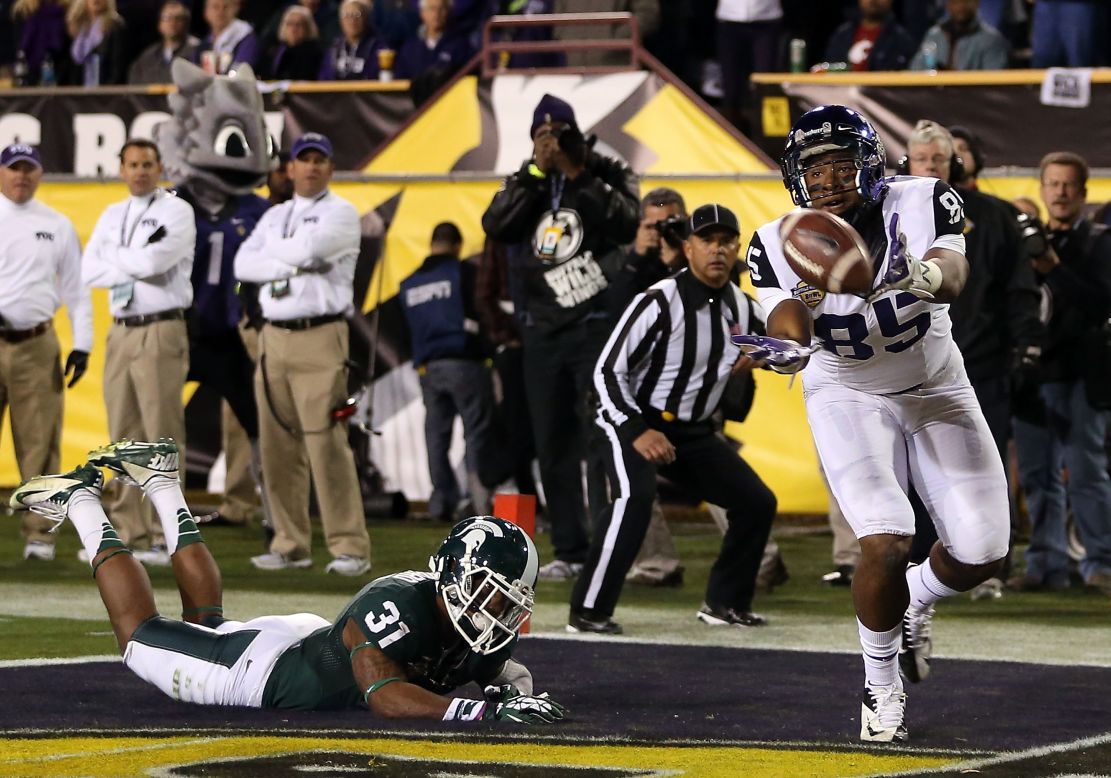 LaDarius Brown of the Horned Frogs is unable to catch a pass in the end zone past Darqueze Dennard of the Michigan State Spartans during the second quarter on December 29.