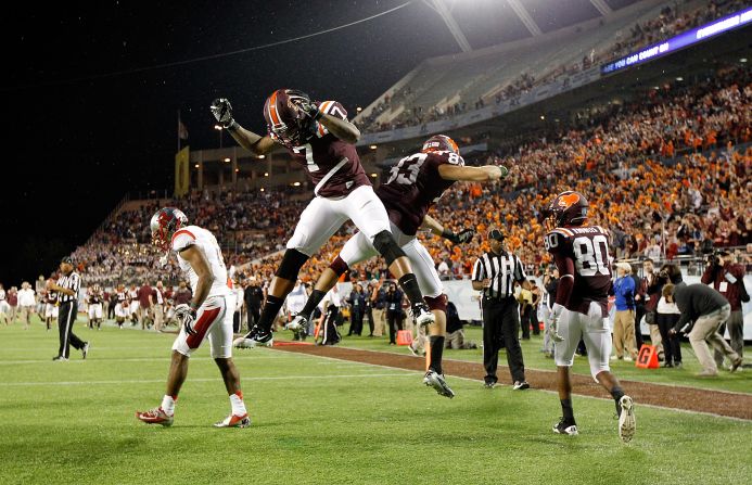 Corey Fuller of the Virginia Tech Hokies celebrates his touchdown catch with Marcus Davis during the Russell Athletic Bowl Game against the Rutgers Scarlet Knights at the Florida Citrus Bowl on Friday, December 28, in Orlando.