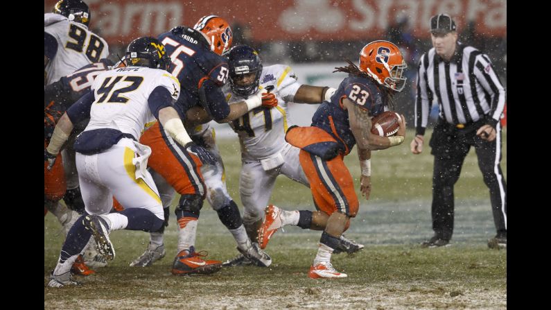 Prince-Tyson Gulley of the Syracuse Orange runs for a touchdown against the West Virginia Mountaineers in the New Era Pinstripe Bowl.