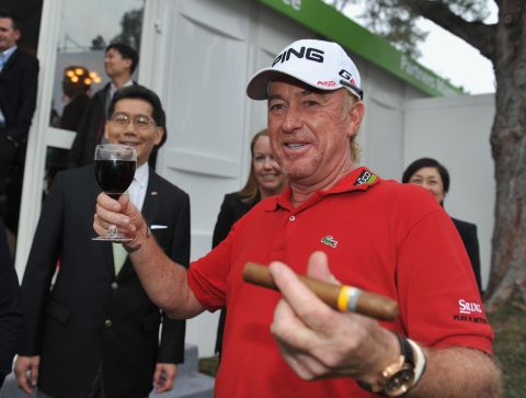 Jimenez celebrates with a glass of red wine and a cigar after claiming victory at the 2012 Hong Kong Open. He would return a year later to successfully defend his title -- his fourth success at the tournament. 