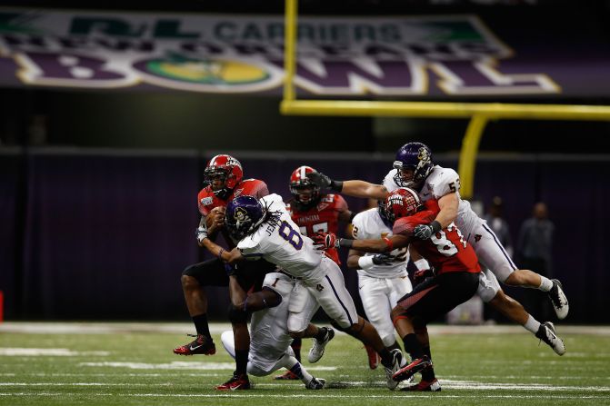 Terrance Broadway of the Louisiana-Lafayette Ragin Cajuns is tackled by Jacobi Jenkins of East Carolina on December 22.