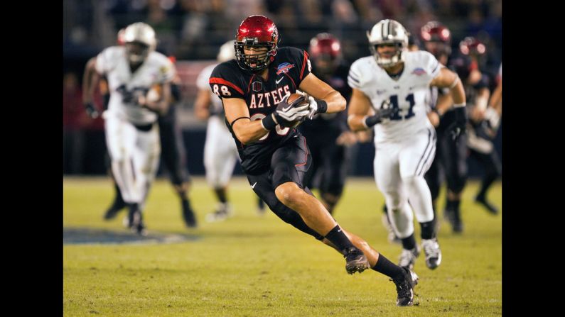 Gavin Escobar of the San Diego State Aztecs runs with the ball in the first half of the game against the BYU Cougars in the Poinsettia Bowl at Qualcomm Stadium on Thursday, December 20, in San Diego.