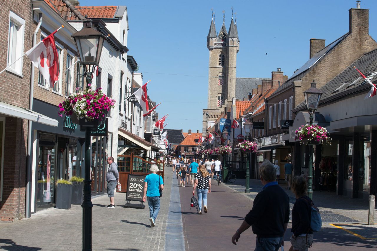 People walk on a shopping street in Sluis, Netherlands, near the Belgian-Dutch border on May 31.