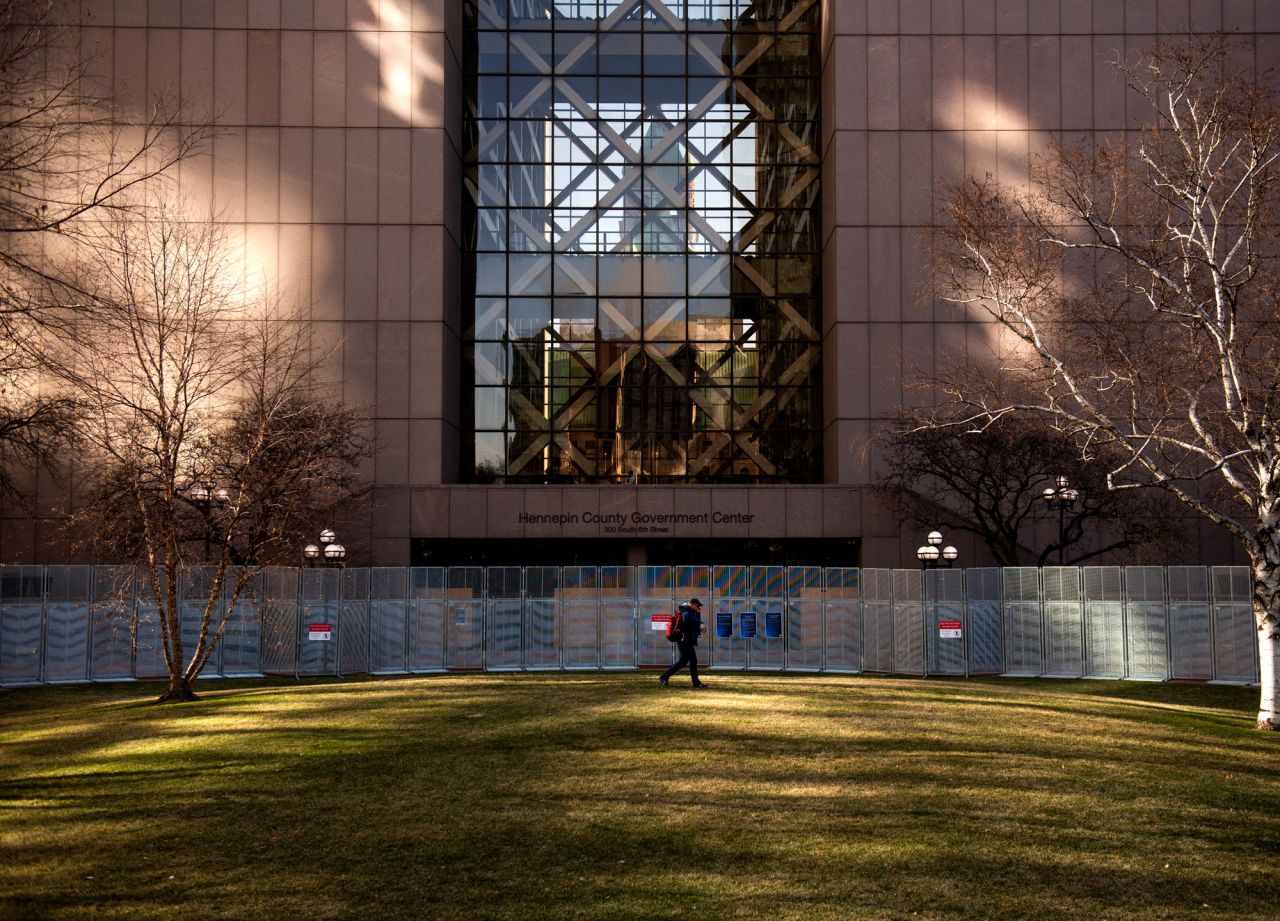 A man walks on the lawn outside the Hennepin County Government Center on April 1 in Minneapolis, Minnesota. 