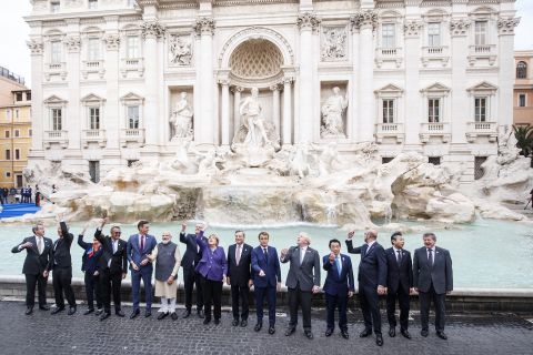 G20 world leaders throw coins into the Trevi Fountain during the G20 summit in Rome, Sunday, October 31, 2021. 