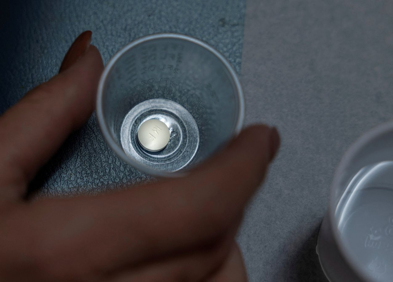 A patient prepares to take mifepristone at Women's Reproductive Clinic of New Mexico in Santa Teresa, on January 13, 2023. 