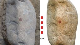 A. The object before being fully excavated; B. Once unearthed, it is possible to appreciate the three main cavities and the central position of the red dot.