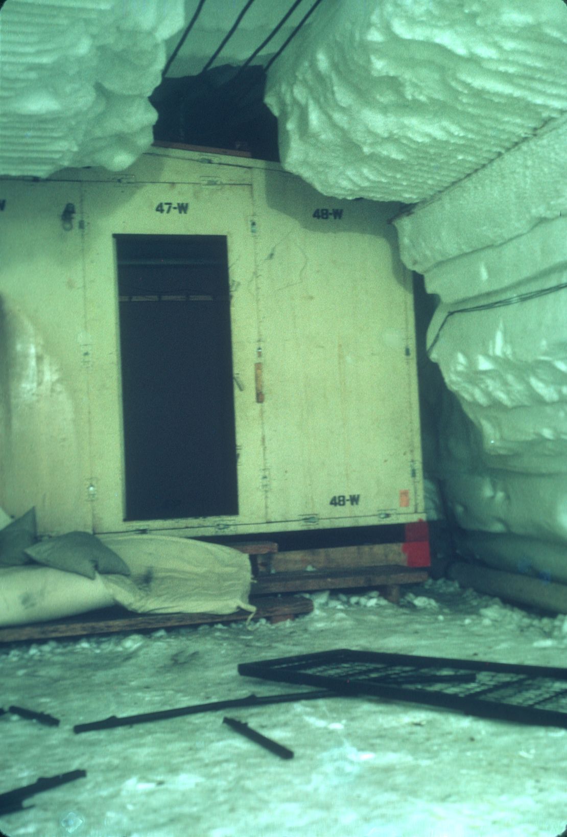 The gradual movement of snow and ice slowly narrowed and deformed the tunnels at Camp Century, crushing some of the buildings over time.