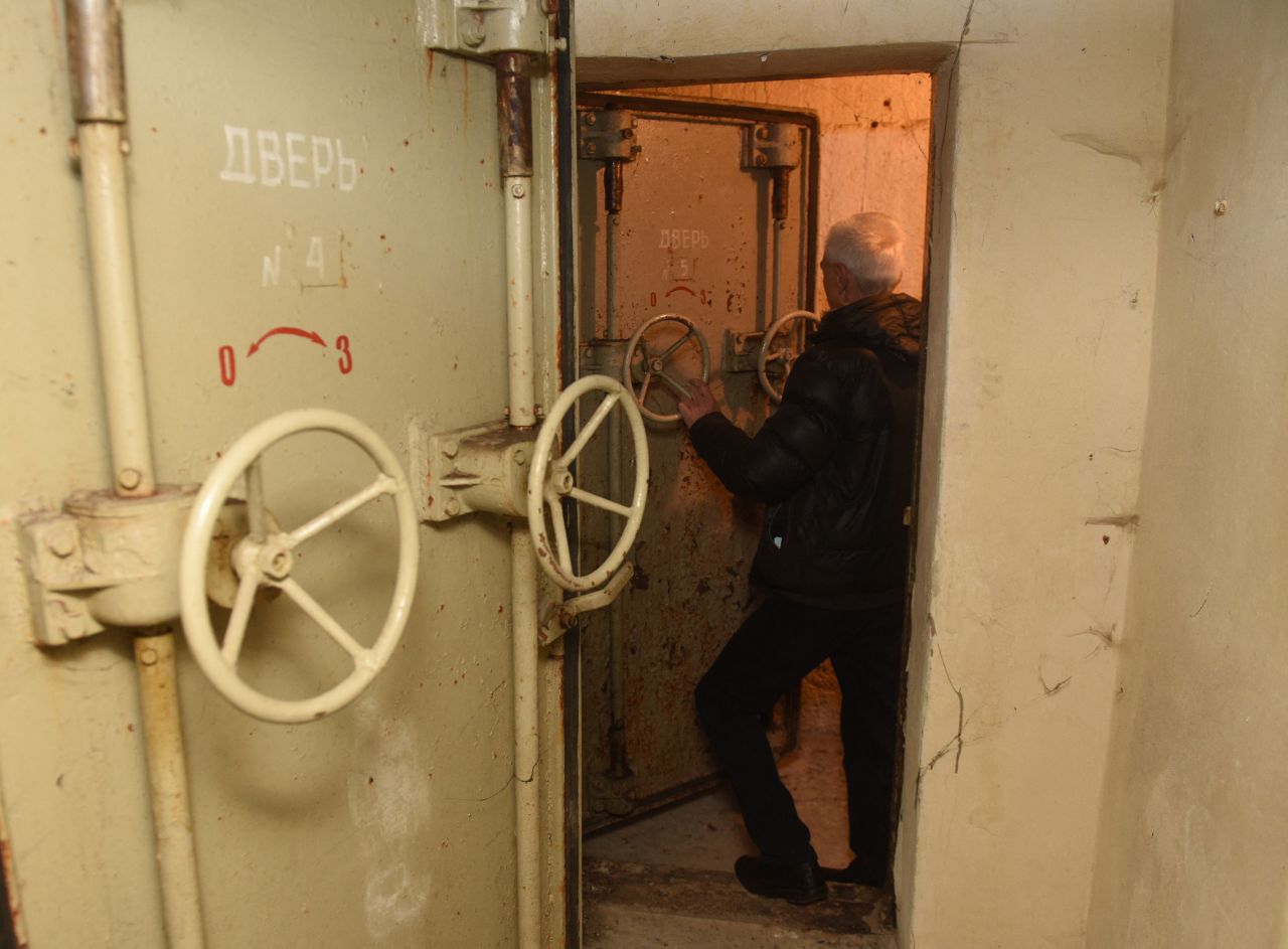 An employee inspects a bomb shelter located in the center of the western Ukrainian city of Lviv on February 21.