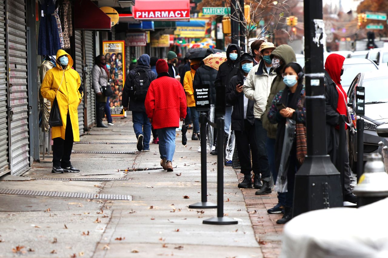 People wait in line to the enter CityMD in the Flatbush neighborhood of Brooklyn on November 23 in New York City. 