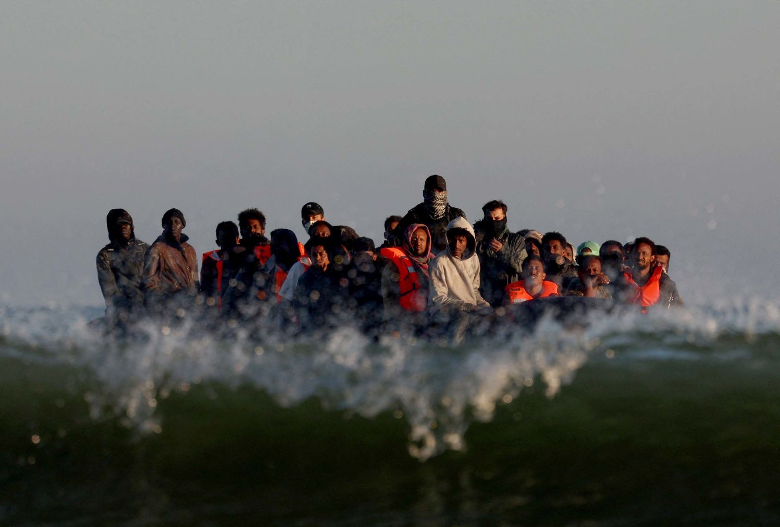 Migrants on an inflatable dinghy leave the coast of northern France on Monday, August 25. They were trying to cross the English Channel to reach Britain.