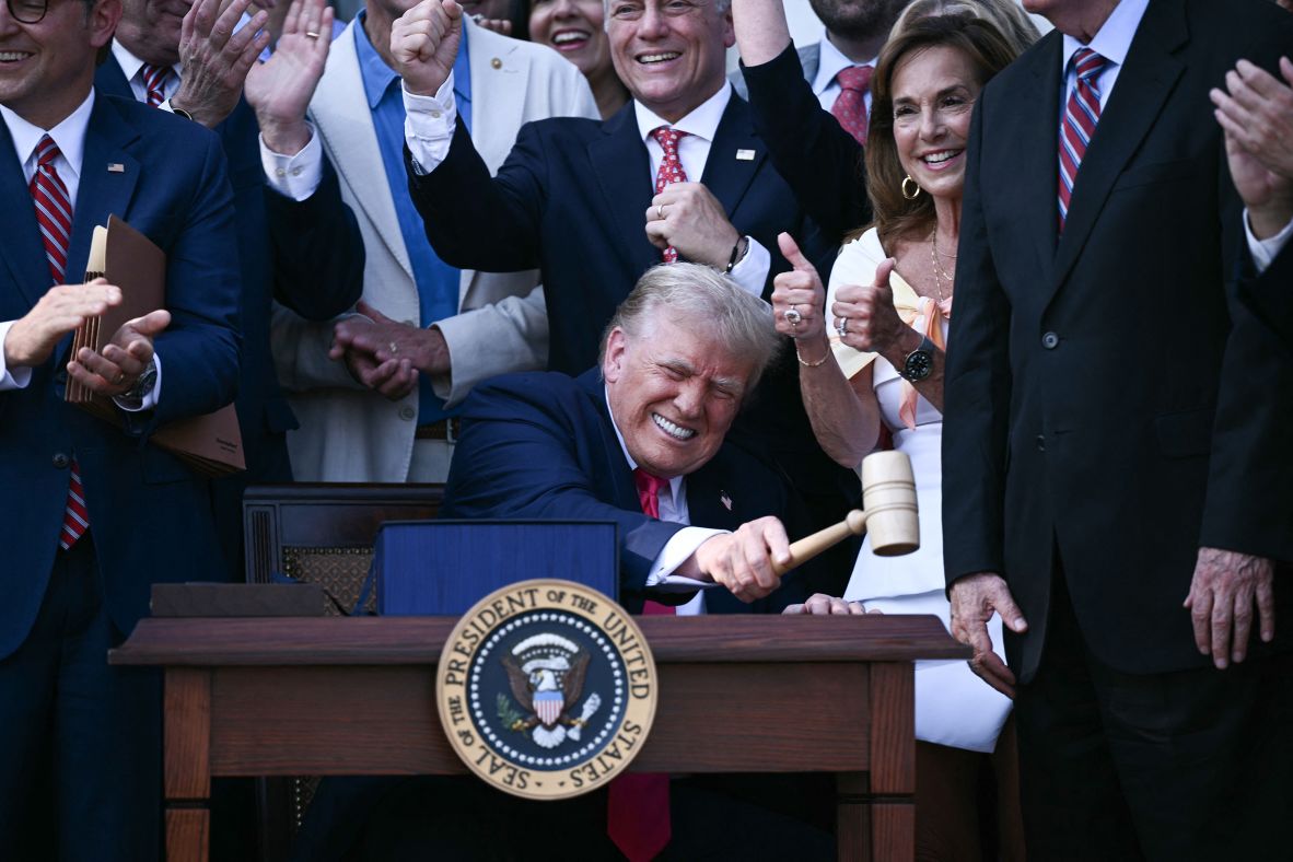 US President Donald Trump bangs a gavel after signing a sweeping tax and spending cuts package he called his <a  target="_top" href="/newspapers?url=https://www.cnn.com/politics/big-beautiful-bill-text-compare-dg">“big, beautiful bill”</a> on Friday, July 4.