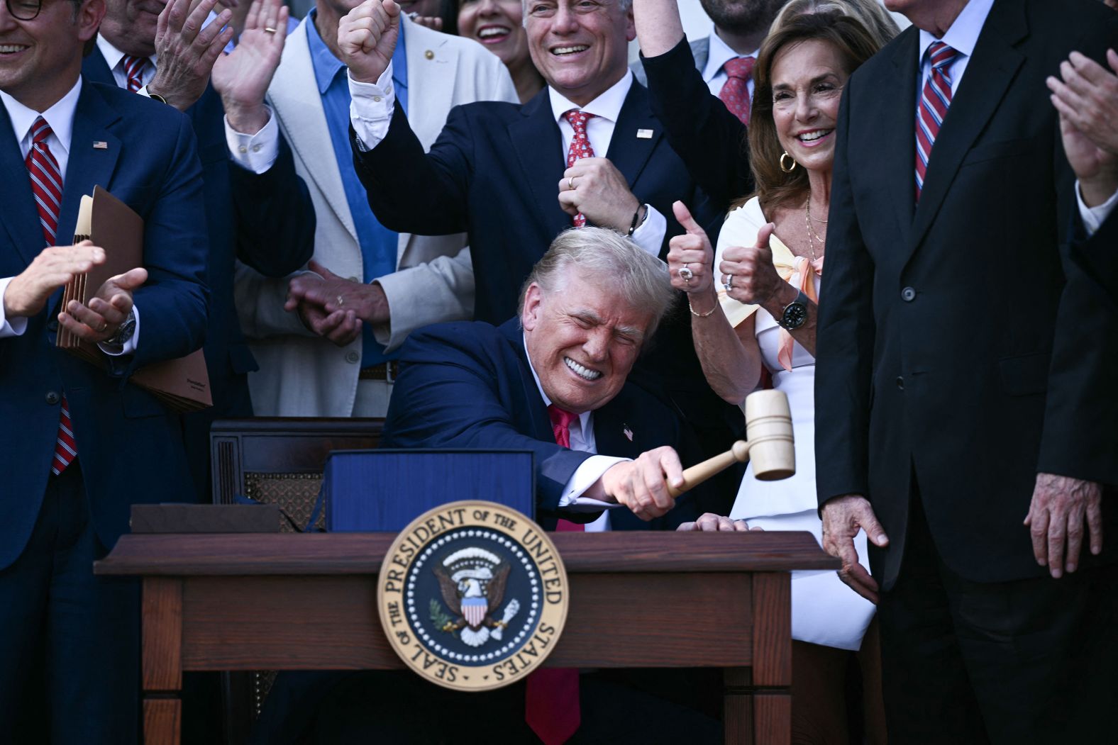 US President Donald Trump bangs a gavel after signing a sweeping tax and spending cuts package he called his <a href="index.php?page=&url=https%3A%2F%2Fwww.cnn.com%2Fpolitics%2Fbig-beautiful-bill-text-compare-dg">“big, beautiful bill”</a> on Friday, July 4.