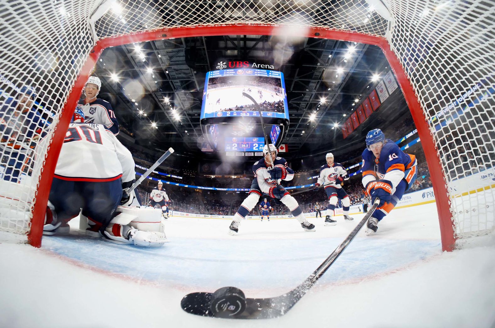 The New York Islanders’ Simon Holmström scores a goal past Columbus goalie Elvis Merzļikins during an NHL game in Elmont, New York, on Sunday, November 2. It came late in the third period, lifting the Islanders to a 3-2 victory.