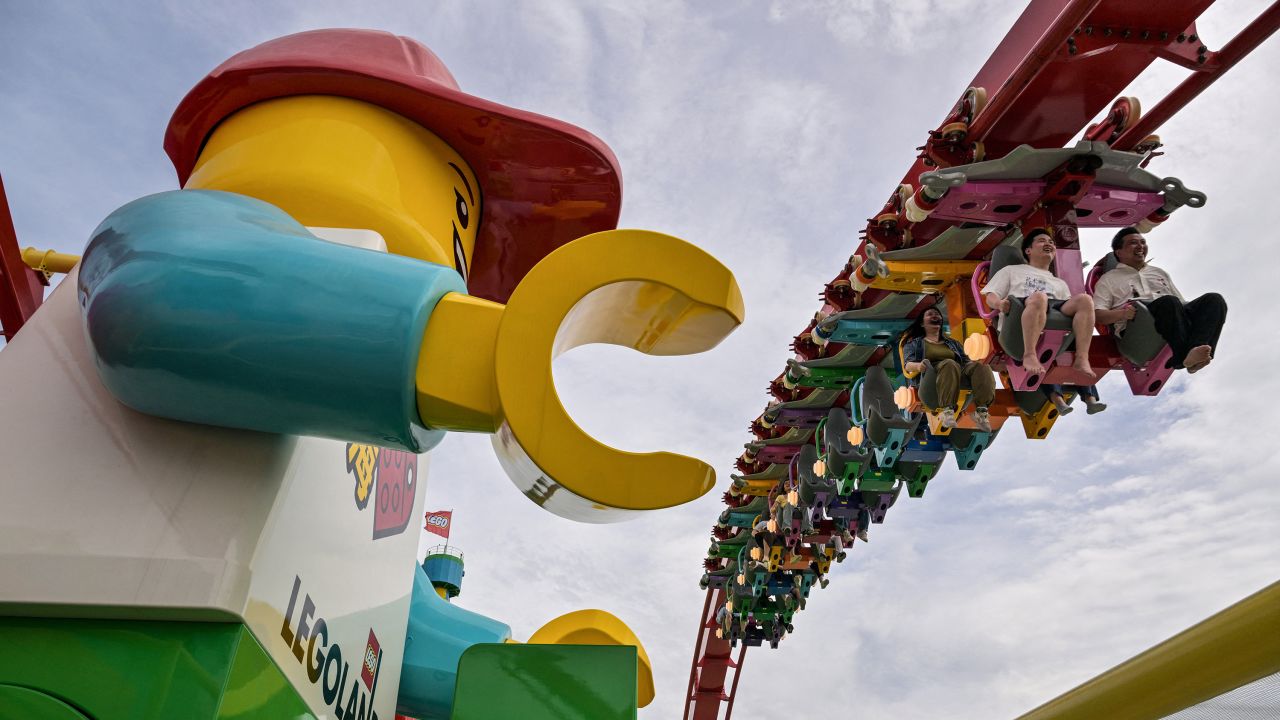 TOPSHOT - People ride a roller coaster at the new LEGOLAND Shanghai Resort, at the Jinshan district in Shanghai, on June 20, 2025. The largest LEGOLAND in the world will be officially opened in Shanghai on July 5th. (Photo by Hector RETAMAL / AFP) (Photo by HECTOR RETAMAL/AFP via Getty Images)          

Tristen