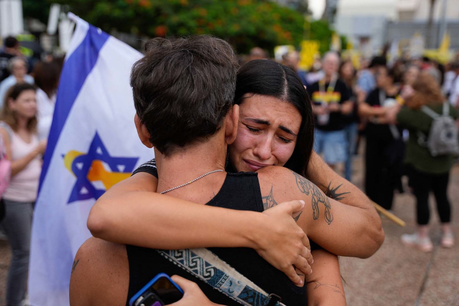 People in Hostage Square, a public plaza in Tel Aviv, Israel, react following news of a Hamas-Israel ceasefire deal on Thursday, October 9.