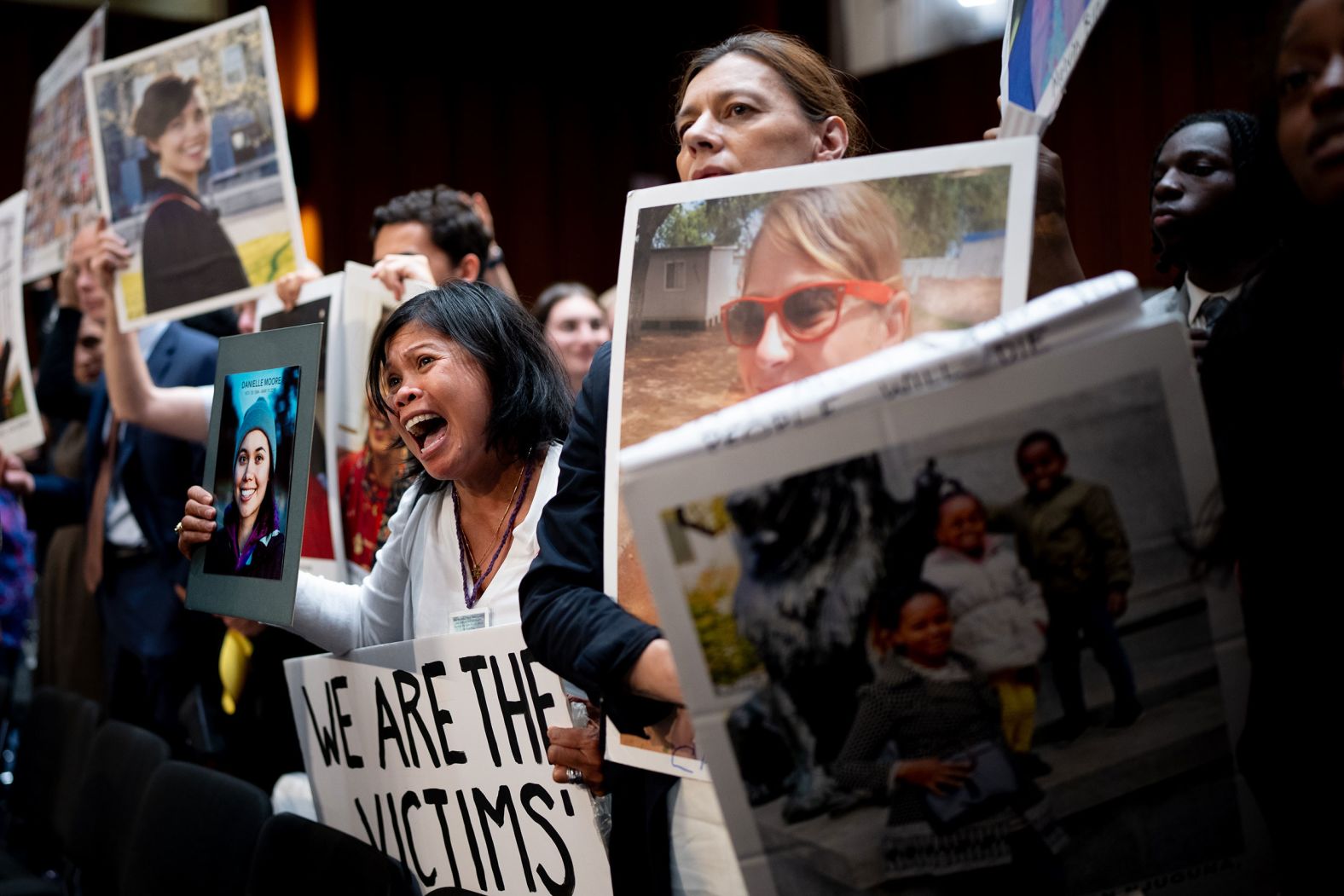 People who lost family members in plane crashes hold up photos of their loved ones as Boeing CEO Dave Calhoun leaves a US Senate hearing in Washington, DC, on Tuesday, June 18. During the hearing, <a href="index.php?page=&url=https%3A%2F%2Fwww.cnn.com%2Fbusiness%2Flive-news%2Fboeing-ceo-testify-senate%23h_5e3e56bf8ea086a1a84a4fe0008ae17c">Calhoun faced bipartisan criticism</a> against the company’s safety, transparency and quality standards. He acknowledged that the company had retaliated against employees who have raised safety concerns, and before his opening remarks he turned to victims’ family members and apologized.