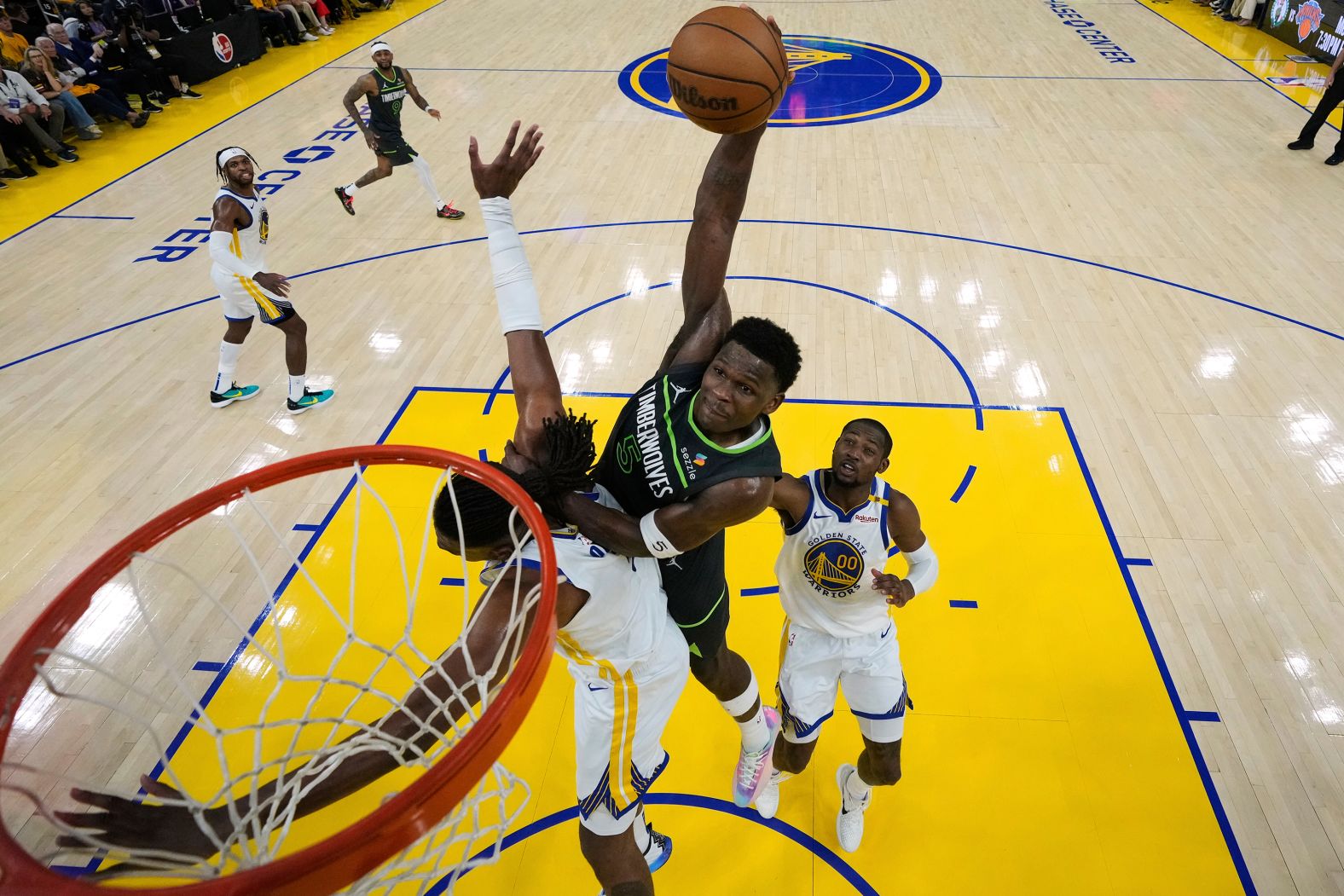 Minnesota Timberwolves guard Anthony Edwards dunks over the Golden State Warriors’ Kevon Looney during an NBA playoff game on Saturday, May 10. <a href="index.php?page=&url=https%3A%2F%2Fwww.cnn.com%2F2025%2F05%2F15%2Fsport%2Fminnesota-timberwolves-golden-state-warriors-game-5-spt">The Timberwolves defeated the Warriors in five games</a> to advance to the Western Conference Finals.