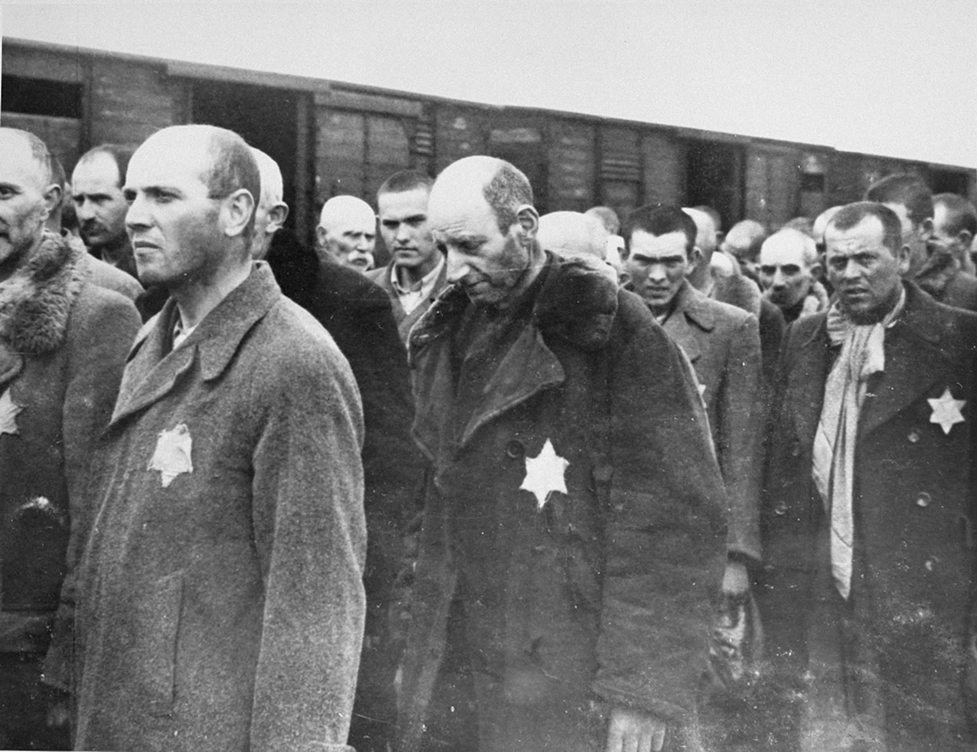 Jewish men are lined up at the Auschwitz-Birkenau camp in May 1944. This photo is from a Nazi documentation of the events at the camp.